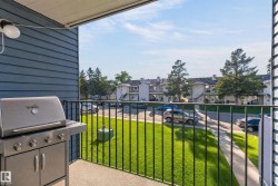 Balcony with black metal railing and concrete flooring - 