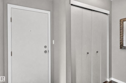 Entry door with brushed nickel hardware - #204 7407 171 St Nw, Edmonton, AB 