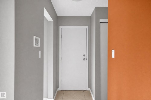 White interior door with chrome hardware - #204 7407 171 St Nw, Edmonton, AB 