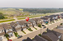 Aerial perspective showcasing a residential street with uniform contemporary homes - 