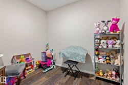 Interior room featuring neutral wall paint and wood-finish flooring - 