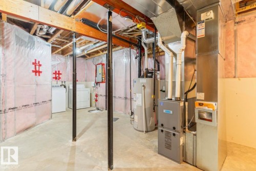 Unfinished basement featuring exposed wood joists, concrete flooring, and insulated walls - 79 Catalina Crest, Fort Saskatchewan, AB - Indoor Photo Showing Basement