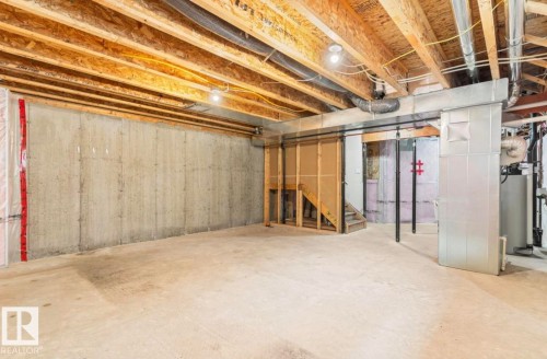 Unfinished basement featuring concrete walls and flooring - 79 Catalina Crest, Fort Saskatchewan, AB - Indoor Photo Showing Basement