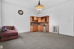 Built-in corner cabinetry with integrated wine storage, under-cabinet lighting, and a beverage refrigerator - 
