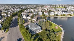 Waterfront property with a private dock, expansive green space, and a charming gazebo - 
