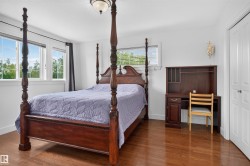 Hardwood flooring, recessed windows, built-in shelving, white paneled doors, and a ceiling-mounted light fixture - 