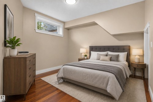 Hardwood flooring, painted walls, white trim, and a high window - 1251 Summerside Drive Sw, Edmonton, AB 
