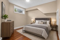 Hardwood flooring, painted walls, white trim, and a high window - 