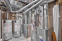 Dual water heaters and HVAC units providing comprehensive climate control - 