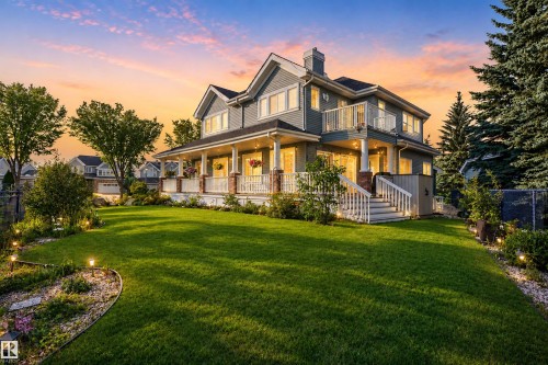 Expansive landscaped lawn with accent lighting - 1251 Summerside Drive Sw, Edmonton, AB 