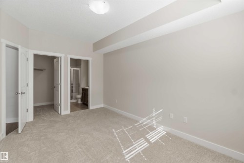 bedroom with walk-in closet & ensuite - #111 4922 52 St, Gibbons, AB 