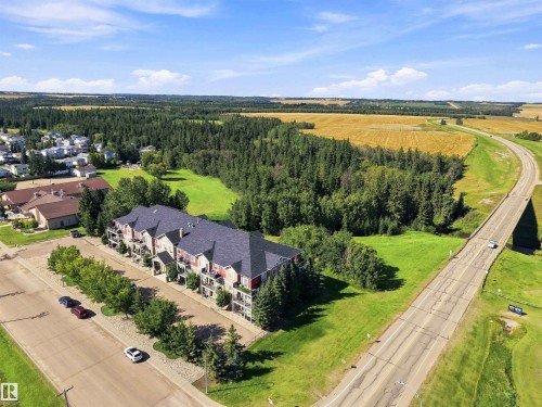 aerial view of the building - close to walking trails & river valley - #111 4922 52 St, Gibbons, AB 