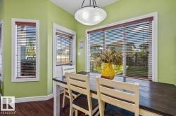 Wood-finish flooring with white trim and a ceiling-mounted light fixture - 