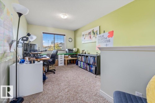 Window with horizontal blinds, neutral carpet, and recessed lighting - 11506 17 Avenue Sw, Edmonton, AB 