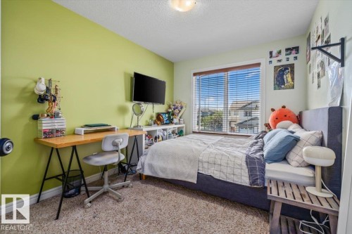 Recessed lighting, wood-finish window blinds, and light-colored carpeting - 11506 17 Avenue Sw, Edmonton, AB 
