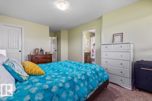 Carpeted flooring, neutral wall color, and a ceiling-mounted light fixture - 11506 17 Avenue Sw, Edmonton, AB 