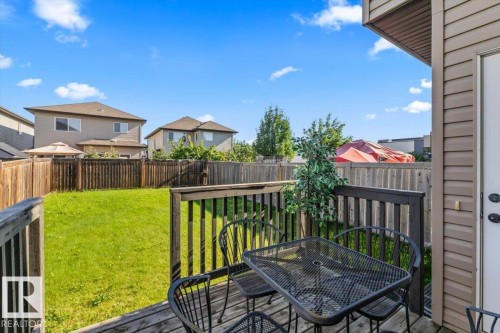 Expansive backyard with a manicured lawn and wood fencing - 11506 17 Avenue Sw, Edmonton, AB 