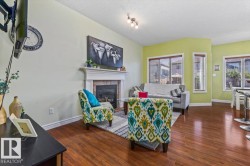 Built-in fireplace with a stone surround, wood mantel, and hearth - 
