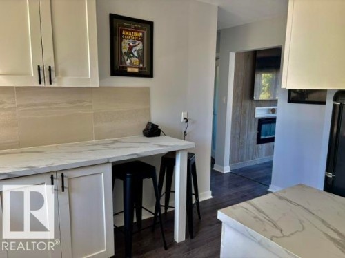 White shaker cabinetry with matte black hardware - 5614 50 Street, Vegreville, AB 