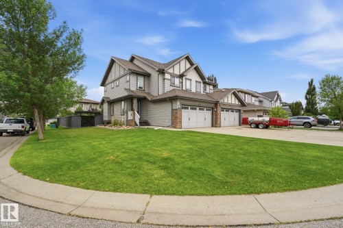Multi-level property with a stone and siding exterior, multiple gables, and an attached two-car garage - 20007 131 Avenue Nw, Edmonton, AB 