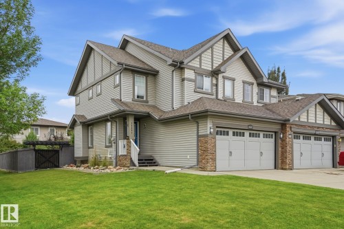 Multi-level facade with stone accents and horizontal siding - 20007 131 Avenue Nw, Edmonton, AB 