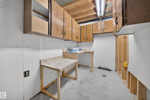 Built-in cabinetry, concrete flooring, exposed ceiling joists, and a utility sink - 155 Marlborough Place Nw, Edmonton, AB 