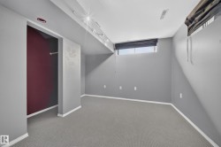 Carpeted flooring, recessed lighting, track lighting, and a window with blinds - 