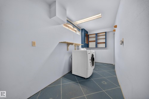 Tiled flooring, built-in shelving, and overhead lighting - 155 Marlborough Place Nw, Edmonton, AB 