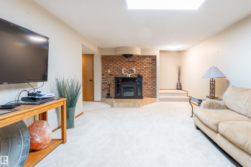 5825 52 Street, Wetaskiwin, AB - Indoor Photo Showing Living Room With Fireplace