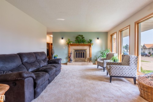 5825 52 Street, Wetaskiwin, AB - Indoor Photo Showing Living Room With Fireplace