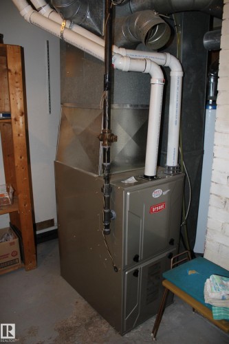 Bryant heating and cooling system with associated ductwork and PVC piping - 4406 49A Street, Vegreville, AB 