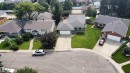Residential property featuring a gray shingle roof, attached front-facing garage, and a concrete driveway - 11131 35A Avenue Nw, Edmonton, AB  - Outdoor 