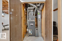 Utility closet featuring a Lennox furnace and associated ductwork - 