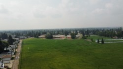 Expansive green spaces featuring multiple sports fields and a running track - 