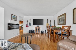 Hardwood-finish flooring extends throughout this open living space - 