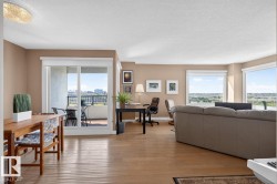 Spacious living area featuring hardwood flooring & expansive windows. West & South Facing Views; - 