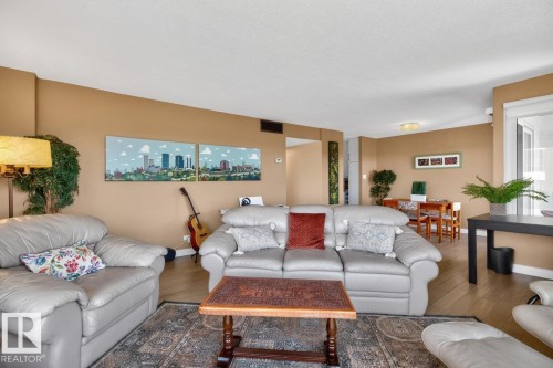 Large living room space perfect for relaxing next to South and West Facing picturesque windows overlooking the River Valley, Golf Course, and City Skyline. - #602 12303 Jasper Av Nw, Edmonton, AB 