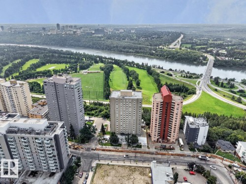 Property is situated on the west end of Jasper Avenue, across from a grocery store, nearby cafes & restaurants and surrounded by the river valley (trails, golf, promenade). South view from balcony facing river valley. - #602 12303 Jasper Av Nw, Edmonton, AB 