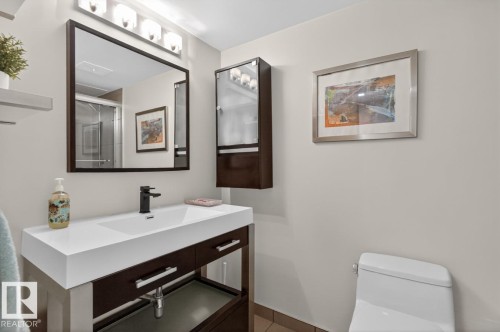 Updated 4 Piece Bathroom featuring stylish vanity, and Tub/Shower. - #602 12303 Jasper Av Nw, Edmonton, AB 