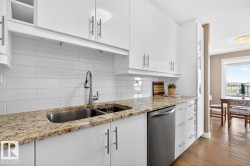 What if you have armloads of groceries?  No Problem. This cleverly designed galley kitchen with convenient pass-through has 2 pullout pantry cupboards and space galore for all your dishes and appliances. - 