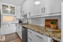 What if you have armloads of groceries?  No Problem. This cleverly designed galley kitchen with convenient pass-through has 2 pullout pantry cupboards and space galore for all your dishes and appliances. - #602 12303 Jasper Av Nw, Edmonton, AB 