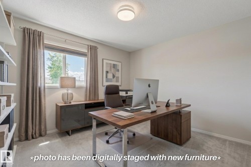 Recessed window with white trim, wall-to-wall carpeting, built-in shelving, and a flush mount ceiling fixture - 591 Byrne Crescent Sw, Edmonton, AB 
