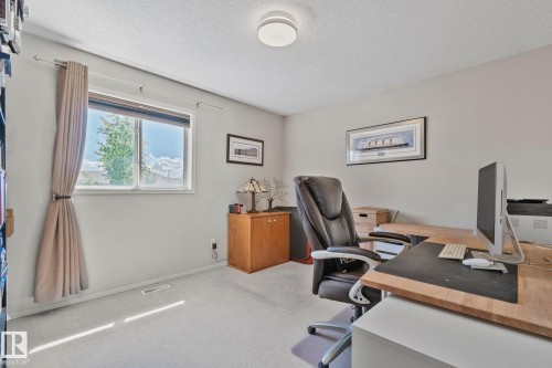 Light-toned wall paint, recessed lighting, and a window with blinds - 591 Byrne Crescent Sw, Edmonton, AB 