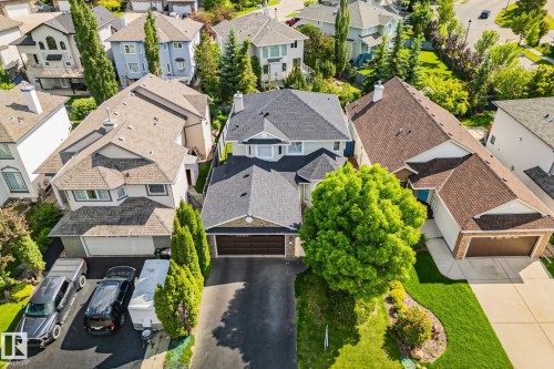 Paved driveway with an attached garage - 591 Byrne Crescent Sw, Edmonton, AB 