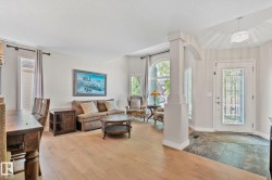 Wood-finish flooring throughout, complemented by a tiled entry - 