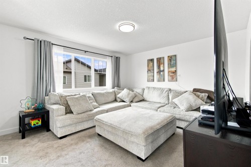 Recessed ceiling light fixture, white walls, and a multi-pane window - 107 Ellice Bend, Fort Saskatchewan, AB 