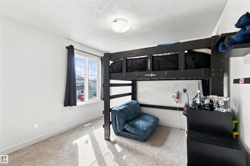 Wall-to-wall carpeting and a single window with dark drapery - 107 Ellice Bend, Fort Saskatchewan, AB 