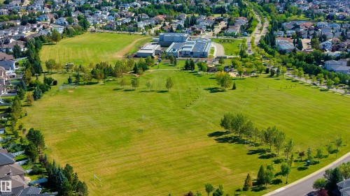 Expansive green space bordered by mature trees and residential properties - 10820 178 Avenue Nw, Edmonton, AB 