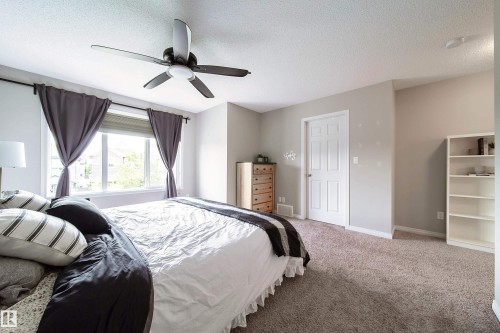 Carpeted flooring, recessed lighting, and a ceiling fan with integrated lighting - 3211 Cherry Crescent Sw, Edmonton, AB 