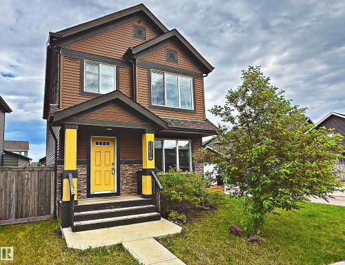 Two-story exterior with brown siding and dark trim - 3211 Cherry Crescent Sw, Edmonton, AB 